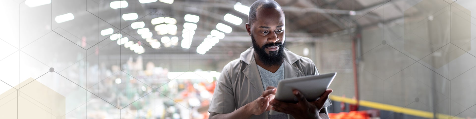 Bearded man looking at tablet device.
