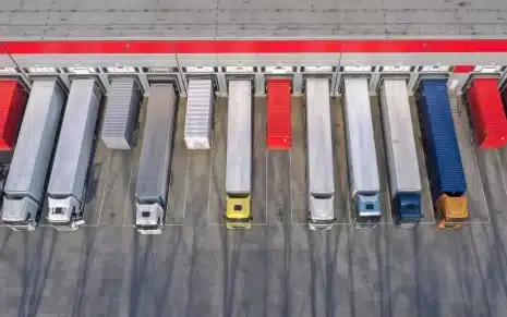 Various eCommerce shipping trucks at a loading dock