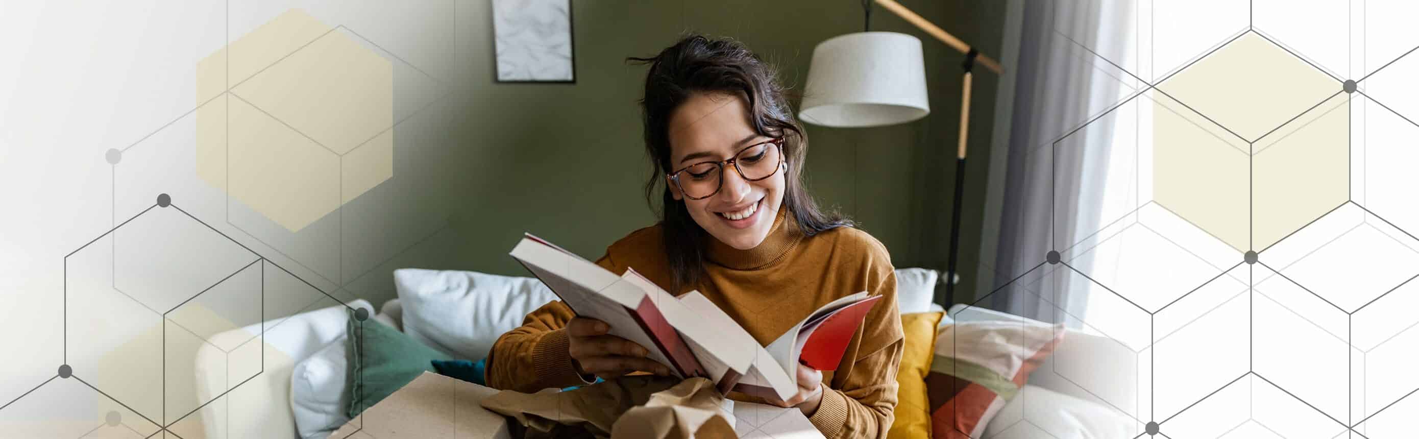 woman opening package of books